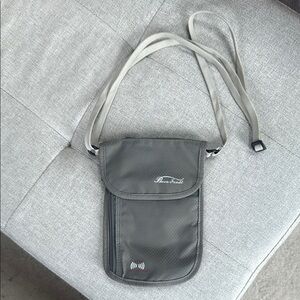 Travel Pouch with Adjustable shoulder Strap & RFID Protection for valuables.